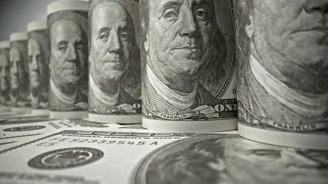American one hundred dollar paper banknote in close up macro view dolly shot. Concept of finance and economy.