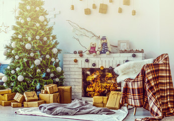 Fireplace and Christmas tree with presents in living room