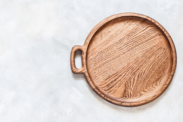 Round Wooden Dish on Grey Background
