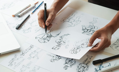 Fototapeta Animator designer Development designing drawing sketching development creating graphic pose characters sci-fi robot Cartoon illustration animation video game film production , animation design studio. obraz