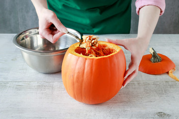 Woman shows how to transform a pumpkin into a halloween lantern