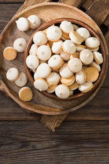 Butter cookies in a white vase on a light gray background