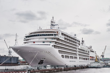 White cruis ship liner docked in the port