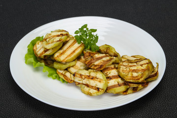 Grilled eggplant slices served basil