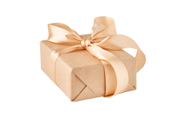 close up gift box in craft paper with golden ribbon isolated on a white background