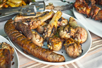 Different types of fried meat on the table. BBQ at the festival.