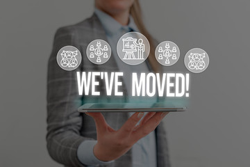 Writing note showing We Ve Moved. Business concept for having strong feelings sadness or sympathy has said or done Woman wear formal work suit presenting presentation using smart device