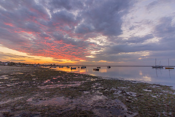 Sunrise cloudy seascape, in Ria Formosa wetlands natural park, shot in Cavacos, Algarve. Portugal.