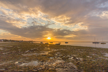 Sunrise cloudy seascape, in Ria Formosa wetlands natural park, shot in Cavacos, Algarve. Portugal.