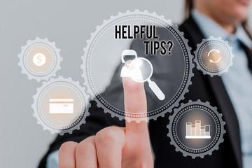 Word writing text Helpful Tips Question. Business photo showcasing secret information or advice given to be helpful knowledge Woman wear formal work suit presenting presentation using smart device
