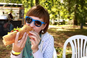 Woman has sandwich