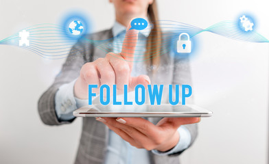 Conceptual hand writing showing Follow Up. Concept meaning a continuation of something that has already been started Female human wear formal work suit presenting smart device