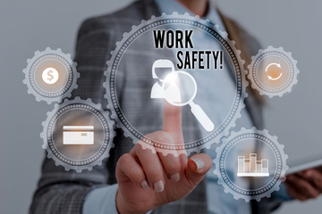 Fototapeta na wymiar Writing note showing Work Safety. Business concept for policies and procedures in place to ensure health of employees Woman wear formal work suit presenting presentation using smart device