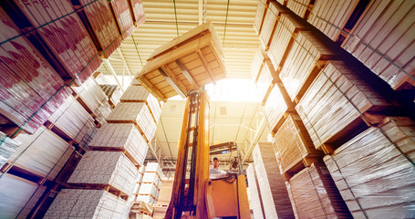 Forklift loader in storage warehouse ship yard. Distribution products. Delivery. Logistics. Transportation. - obrazy, fototapety, plakaty