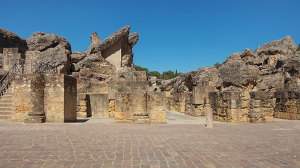 Ruins of the splendid amphitheater, part of archaeological ensemble of Italica, city with a strategic role in the Roman Empire, birthplace of Emperors Trajan and Hadrian, in Santiponce, Seville, Spain