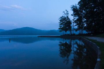 A moody blue evening at a mountain lake park.