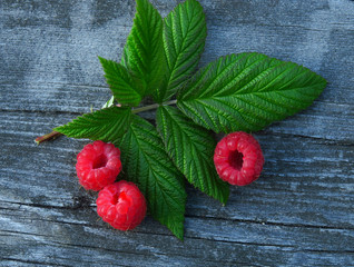 Berry raspberries on a wooden table rustic. Natural detox, fruit dessert, healthy dieting concept. Top view flat lay background.