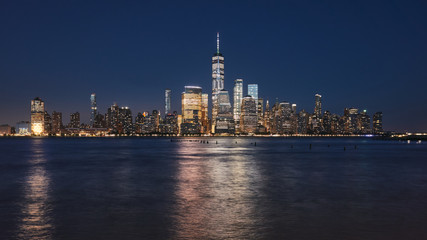Manhattan skyline at night, color toning applied, New York City, USA.