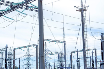Power Tower. High voltage lines and power pylons. City power substation, close-up, transformer with high-voltage wires. High voltage power lines installing on high electric post connected