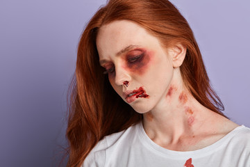 difficult fate, life, woman with awful bruises looking down, close up portrait.innocent victim,...