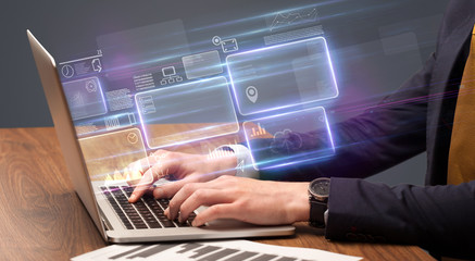 Hand typing on laptop with online accounting system concept