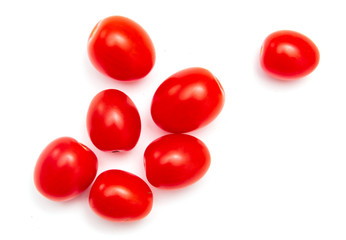 Red cherry tomatoes on a white background