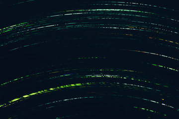 Neon green flowing lights. Illuminated arc dashed lines. Dark abstract background.