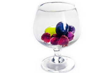 Glass with berries on a white background isolate