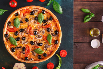 pizza, mushrooms, olives, chicken, tomato sauce, cheese, (ingredients). hot pizza. Top view. copy space