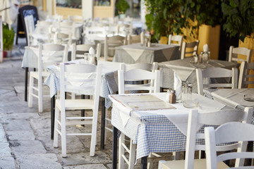 Fototapeta na wymiar Taverna at Greece, table and chair