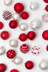 Red and white matte Christmas baubles decoration on white background
