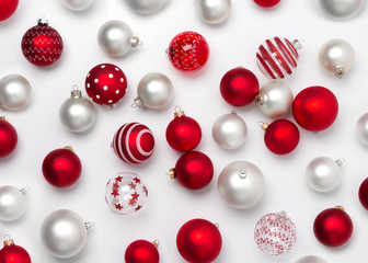 Red and white matte Christmas baubles decoration on white background