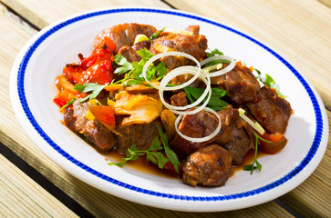 Meat baked with mushrooms and vegetables