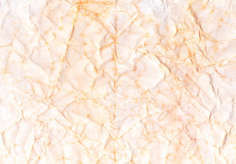 Beige crumpled paper. Wrinkled colorful background. Coffee color wallpaper. Craft page.