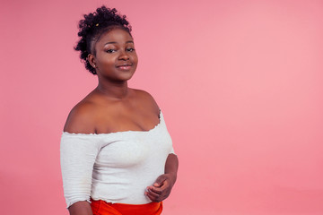 full growth portrait beautiful plus size model wearing white top and red sexy skirt posing in...