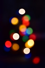 Small chaotic colored circles bokeh on a contrasting black background