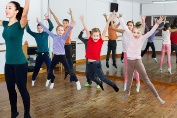 Children dancing contemp in studio smiling and having fun