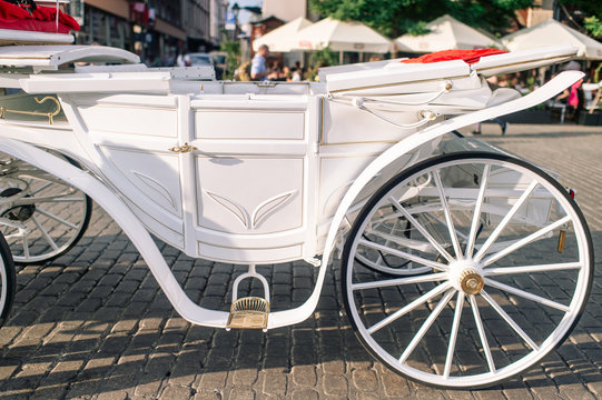Closeup white carriage in Krakow (Cracow ) on the street