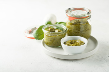 Homemade pesto sauce in jars