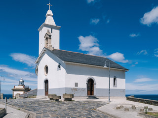Obraz premium White hermitage in coastal town.