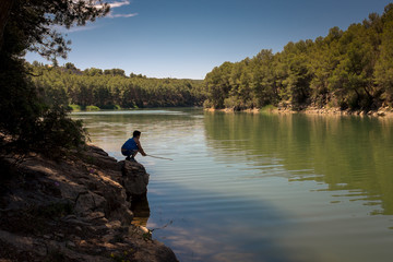 Boy fishing in the lake
