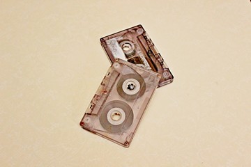 Two audio cassettes located on a white background