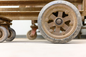 An old wheel in a cart in an old factory