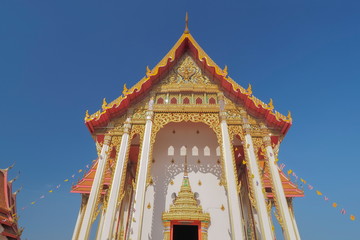 view front of Thai Buddhist Temple with blue sky background, Wat Don Toom, Ban Pong, Ratchaburi, Thailand.