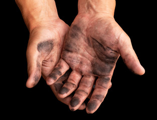 dirty hands after work on a black background