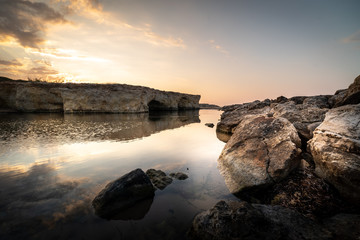 Shot of the Cirica Bay at sunrise. Cirica is a beautiful nature seaside place made of cliffs, rocks and sand in the southern Sicily, Italy
