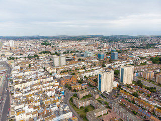 Fototapeta premium Aerial photo of the Brighton and Hove town centre showing hotels, guest houses, local businesses and the roads and streets of the town centre, taken on a bright sunny day with a drone over the town.