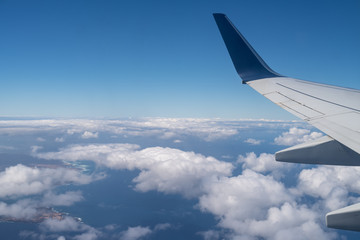 Fototapeta na wymiar Plane wing from inside an airplane