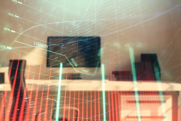Stock market chart and desktop office computer background. Multi exposure. Concept of financial...