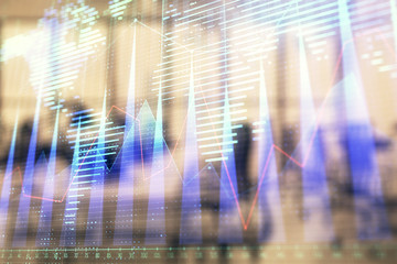 Stock and bond market graph and world map with trading desk bank office interior on background. Multi exposure. Concept of international finance